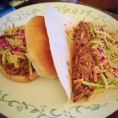 A picture of Chipotle Lime Pulled Pork Tacos w/ Citrus Crema Slaw.