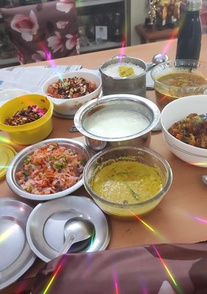A picture of Rice, dal, salad, mixed subzi carrot halwa.