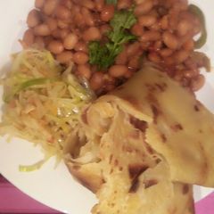A picture of Yellow beans stew with soft layered chapos.