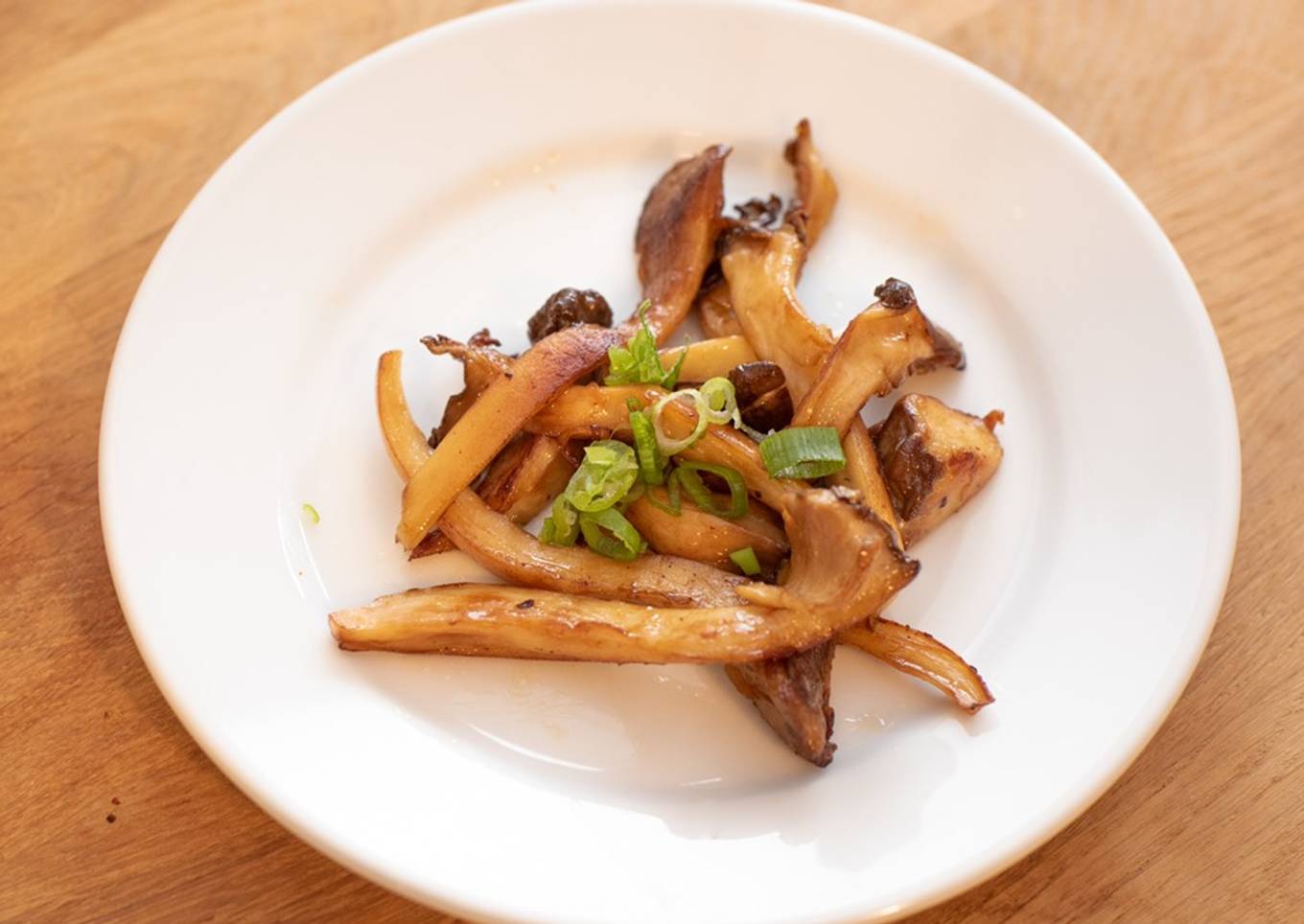 Stir-fried king oyster mushrooms with butter and soy sauce
