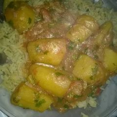 A picture of Rice with Nodules and Matoke stew.