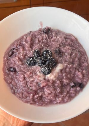 A picture of Risotto with Blueberries and Stracchino Cheese.