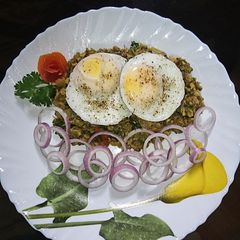 A picture of Sprouted moong fry with egg poach.
