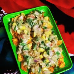 A picture of Creamy cheese sauce nachos chaat.