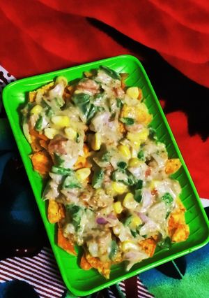 A picture of Creamy cheese sauce nachos chaat.