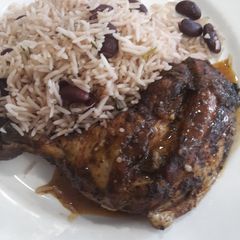 Jerk chickens with pea rice A picture of Jerk chickens with pea rice.
