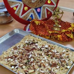 A picture of Paneer kalakand with Koya dry fruits kesar dessert.