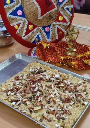 A picture of Paneer kalakand with Koya dry fruits kesar dessert.