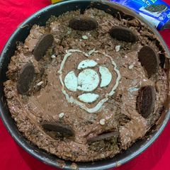 A picture of Eggless chocolate cake decorated with Oreo.