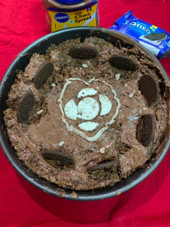 A picture of Eggless chocolate cake decorated with Oreo.