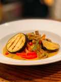 Beef and grilled aubergine red curry topped with Bird eye chillis