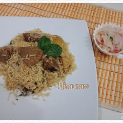 A picture of Beef Biryani With salaad.