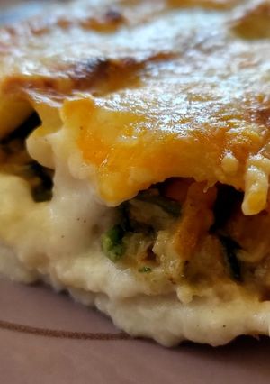 Una foto de Canelones de Espinacas con virutas de pollo estilo durum