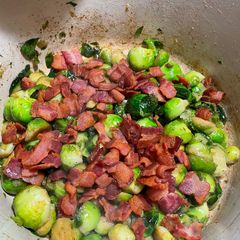 A picture of Apple juice braised Brussels sprouts with bacon.