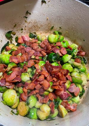 A picture of Apple juice braised Brussels sprouts with bacon.