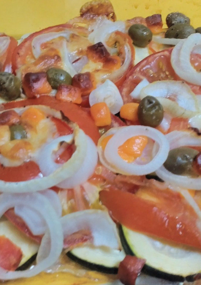 Una foto de Calabacín al horno con tomate y queso