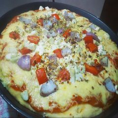 A picture of Pizza with Different Toppings.