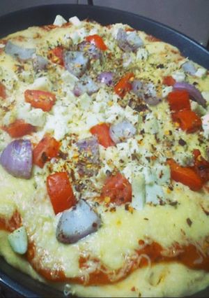 A picture of Pizza with Different Toppings.