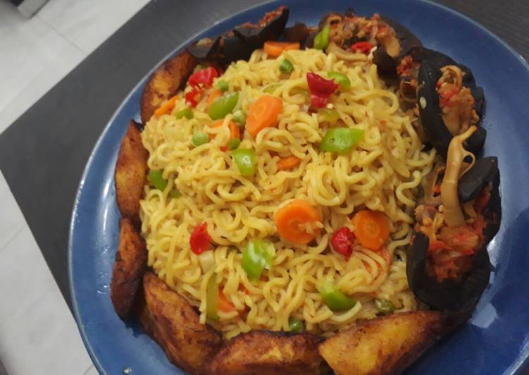 Indomine with fried plantain,snails and vegetables
