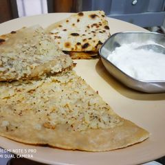 A picture of Cauliflower Paratha and Dahi.