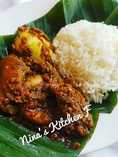 A picture of Rice with pepper sauce.
