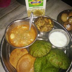 Aloo matar ki sabzi with poori A picture of Aloo matar ki sabzi with poori.