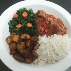 Rice,Fried plantain with vegetable and tomatoe stew A picture of Rice,Fried plantain with vegetable and tomatoe stew.