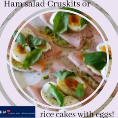 A picture of Ham salad Cruskits or rice cakes with eggs!.