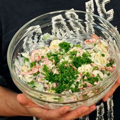 A picture of Potato salad with capsicum and cucumber.