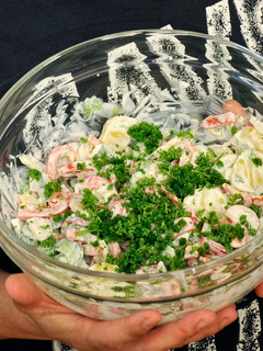 A picture of Potato salad with capsicum and cucumber.