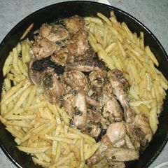 A picture of Oven Baked Chicken and fries.