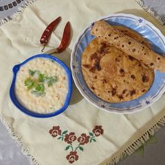 A picture of Paratha with raita.