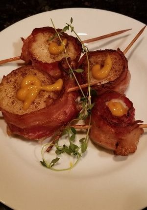A picture of Grilled Scallops, Wrapped in Bacon.