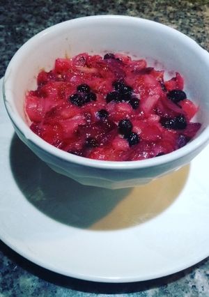 Una foto de Pionono con Coulis de frutos rojos