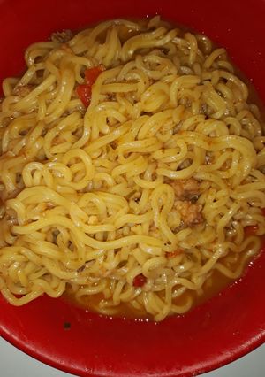 A picture of Seafood indomie with fish chunks.