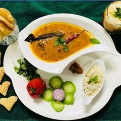 A picture of Red & yellow lentils in kohlapuri gravy.