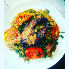 A picture of Porridge beans and vegetable with fried fish.