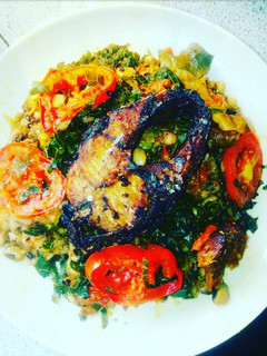 A picture of Porridge beans and vegetable with fried fish.