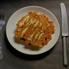 A picture of Okonomiyaki- Japanese Savoury Pancakes.