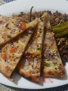 A picture of Mazedar qeema with tandori salad paratha.