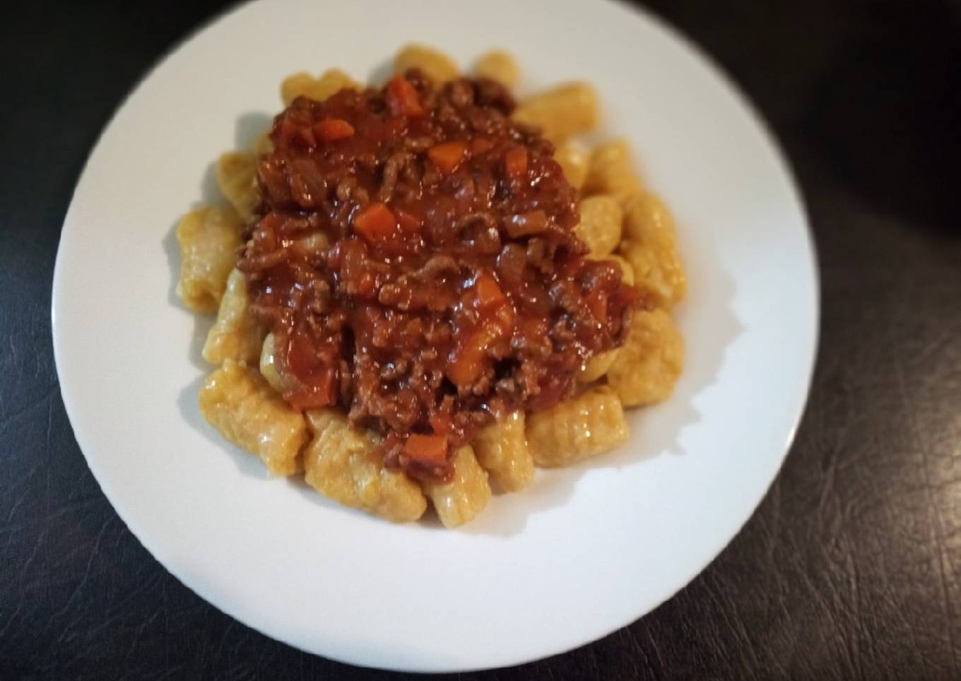 Ñoquis con zapallo a la boloñesa
