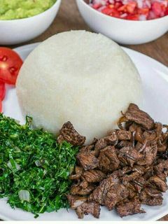 A picture of Ugali, beef, sukuma wiki.