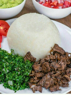 A picture of Ugali, beef, sukuma wiki.