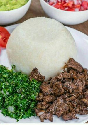 A picture of Ugali, beef, sukuma wiki.