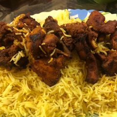 A picture of Chicken tikka mandi arabian recepi with saffron rice.