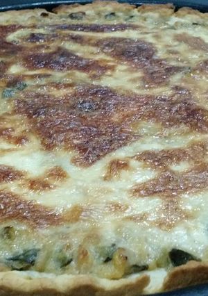 Una foto de Tarta de zapallitos con masa casera