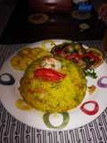 Risotto frutti di mare con monedas de plátano verde y ensalada