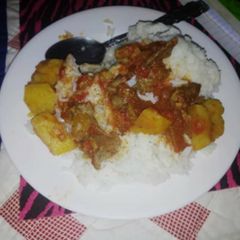 A picture of Boiled rice served with beef stew#festivecontestkakamega#.