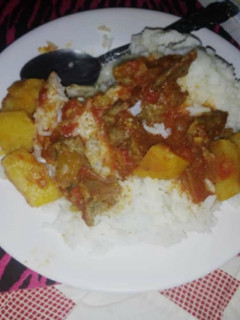 A picture of Boiled rice served with beef stew#festivecontestkakamega#.