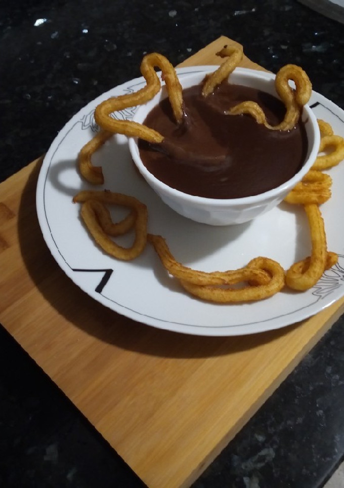 Una foto de Chocolate a la Taza de Colacao con Mini-Churros